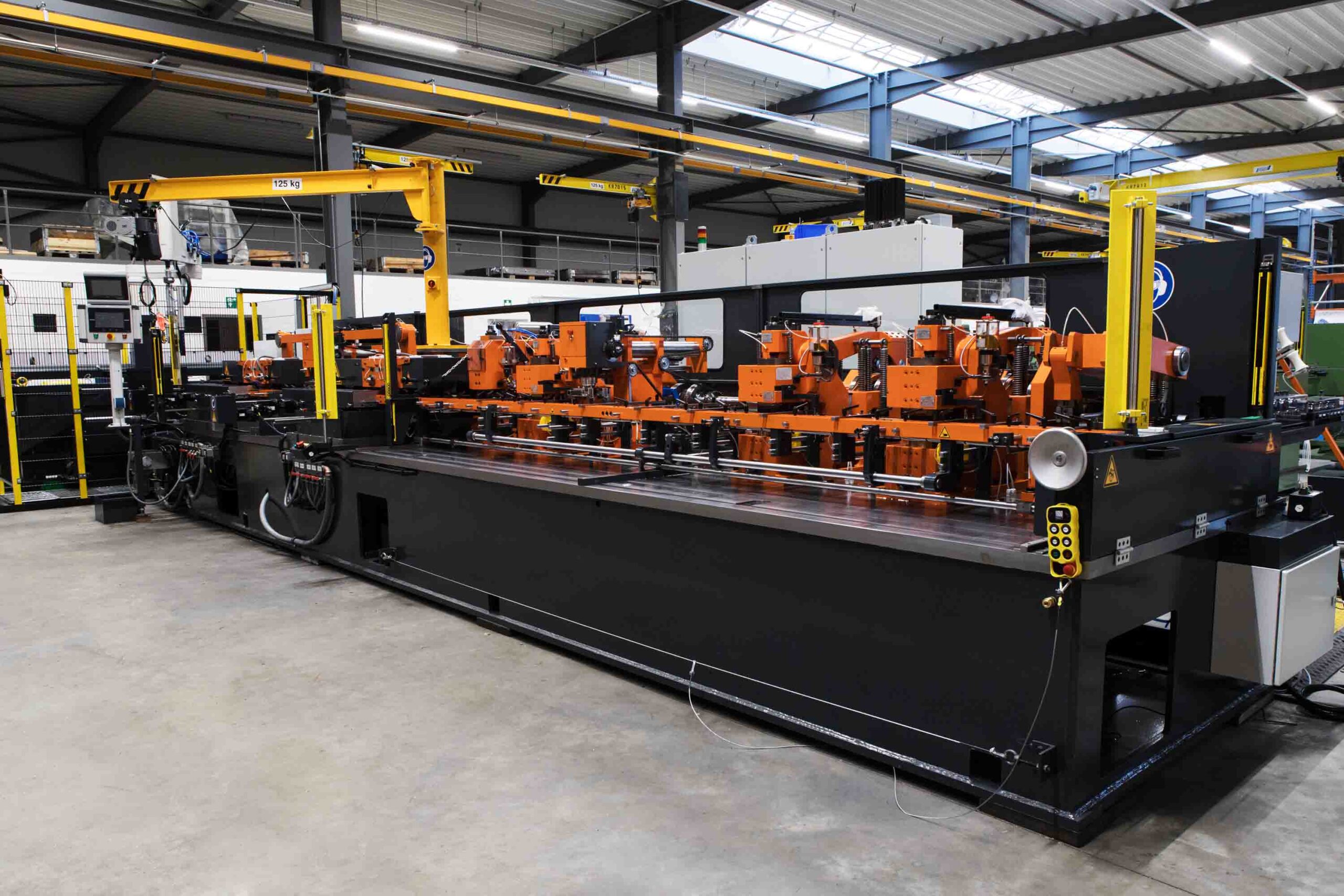 More-in-One Screw and Bolt making machines equipped with reducing and tip-cutting units, two threading rolls and a pick & place robot .all process steps in one machine.